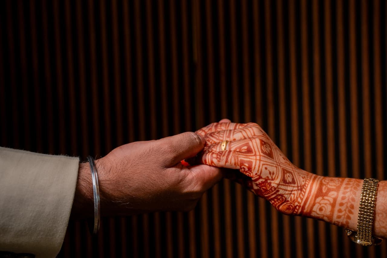 Arun and Benita exchanging rings during their engagement