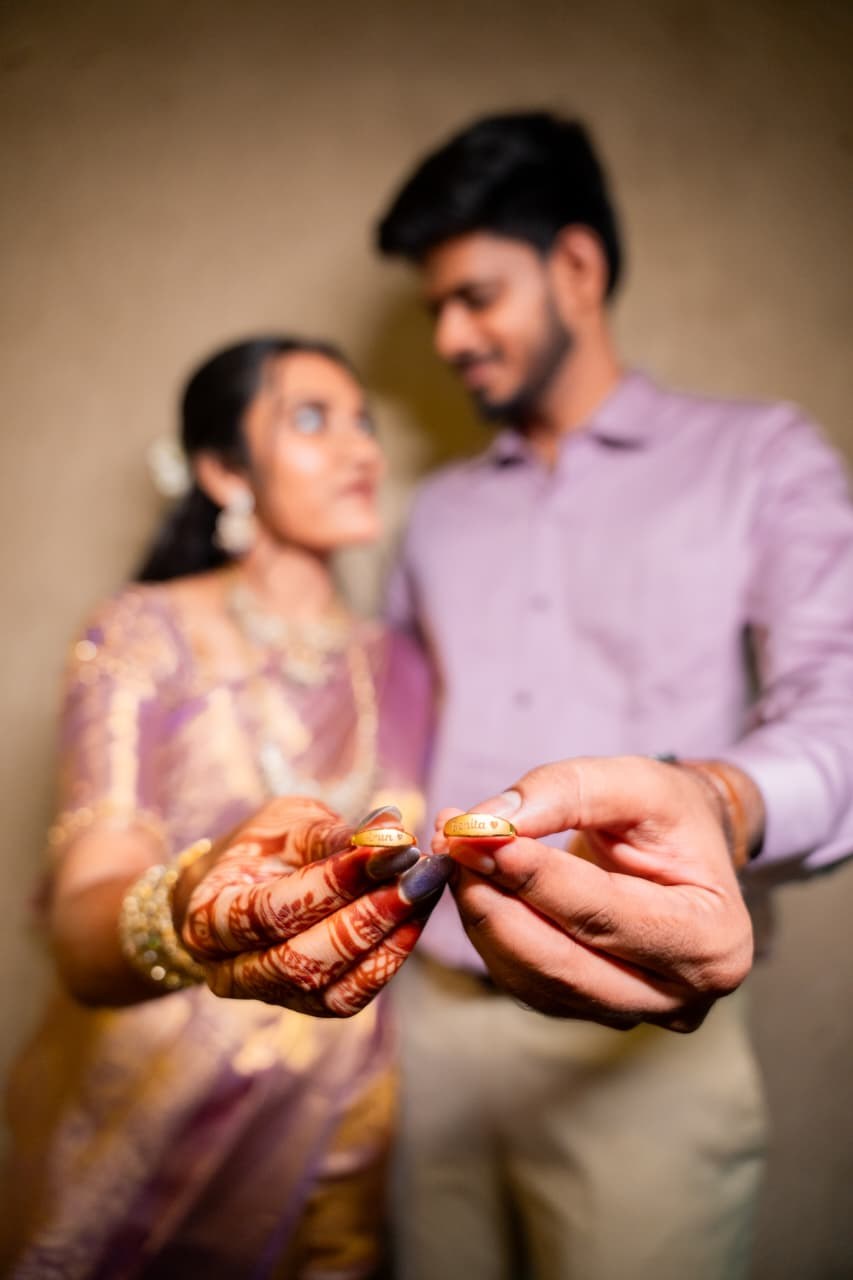 Arun and Benita showing their engagement rings